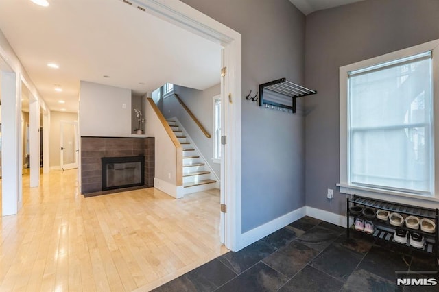 interior space with hardwood / wood-style floors and a fireplace