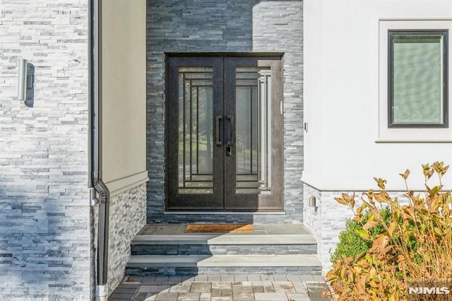 doorway to property featuring french doors