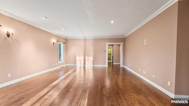 unfurnished room featuring hardwood / wood-style flooring and ornamental molding