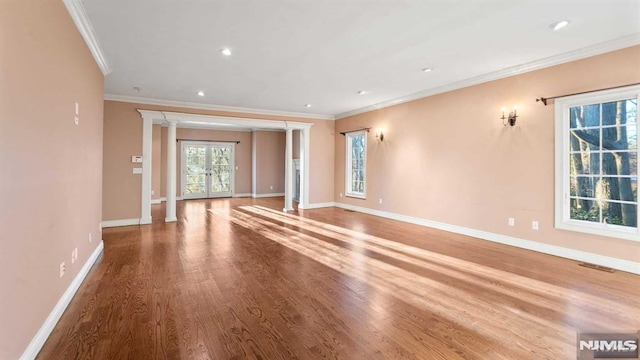 unfurnished room featuring hardwood / wood-style flooring and ornamental molding