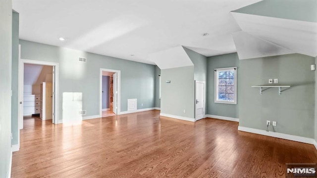 unfurnished living room with hardwood / wood-style floors