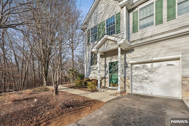 doorway to property featuring a garage