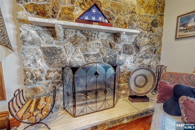 interior details with a stone fireplace