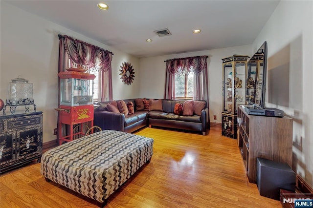 living room with light hardwood / wood-style floors