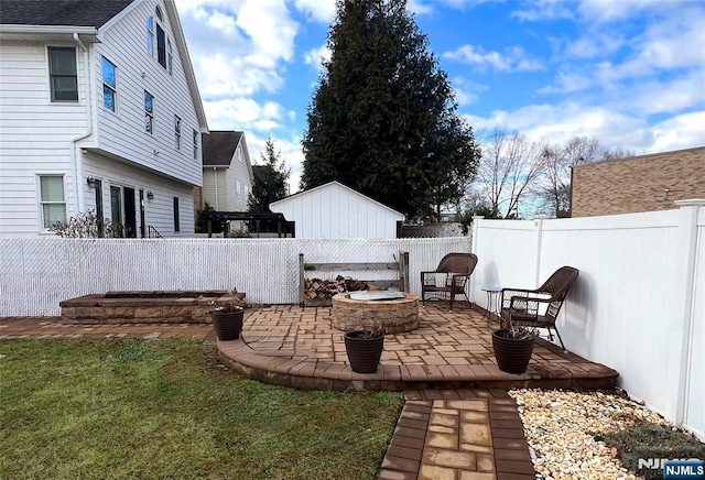 view of patio / terrace with a fire pit