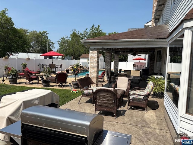 20 Albert St, Moonachie, NJ 07074 - fenced backyard with outdoor dining space, a patio area, outdoor lounge area, a ceiling fan, and an outdoor structure