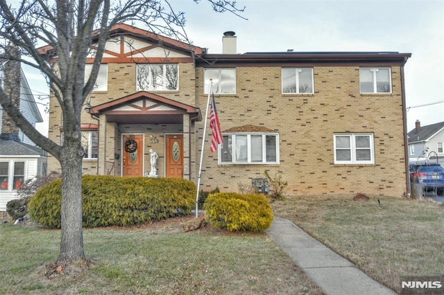 view of front of home with a front lawn