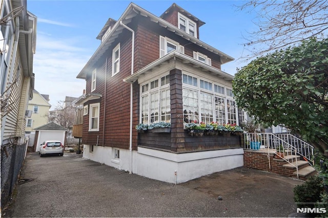 view of side of property featuring a garage