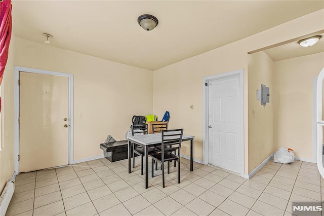 dining area featuring light tile patterned floors