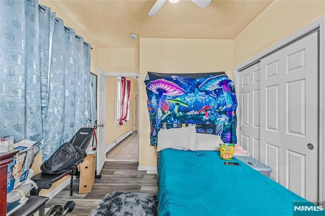 bedroom featuring a closet, ceiling fan, and hardwood / wood-style flooring