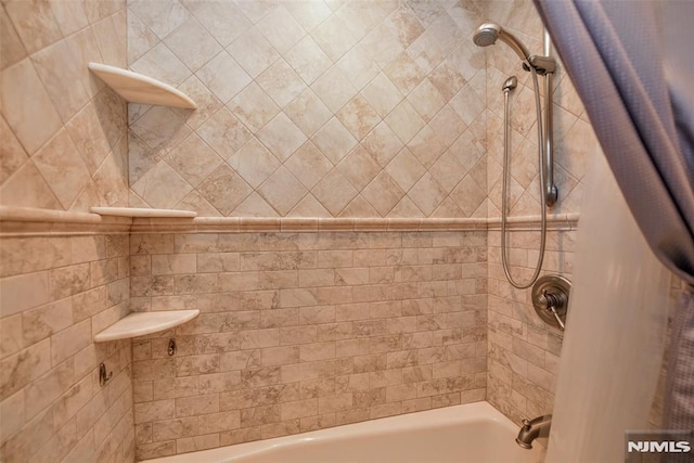 bathroom featuring shower / bathtub combination with curtain