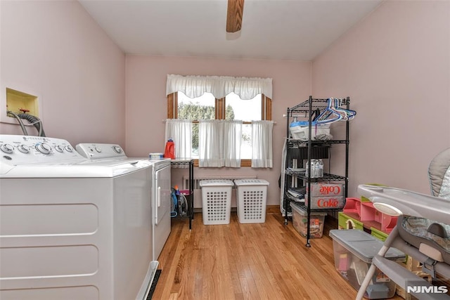 washroom featuring ceiling fan, light hardwood / wood-style floors, and washing machine and dryer