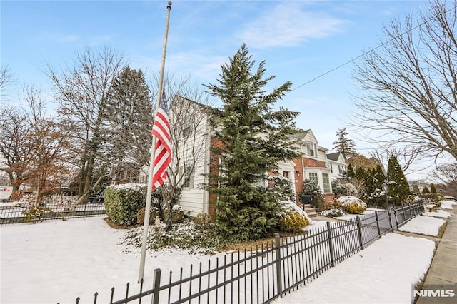 view of snow covered property