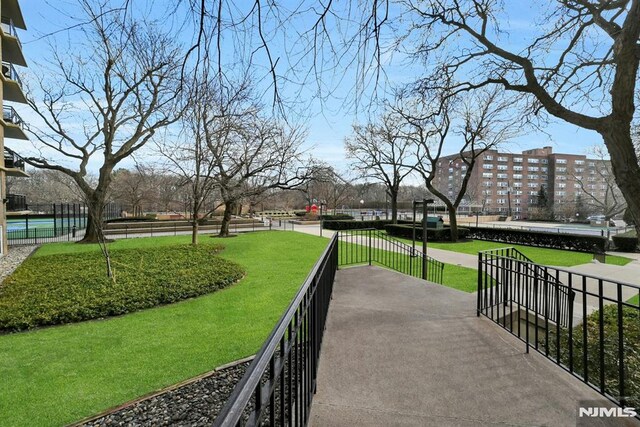 view of home's community with a yard