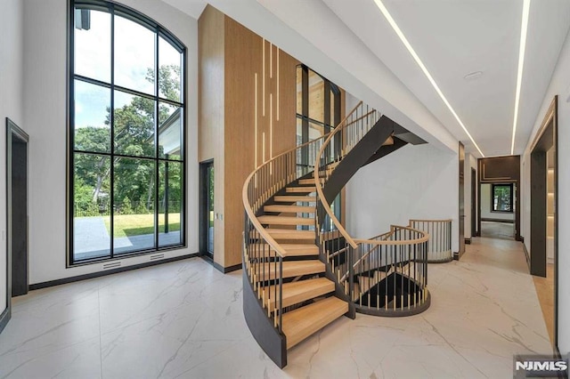 stairway with a towering ceiling