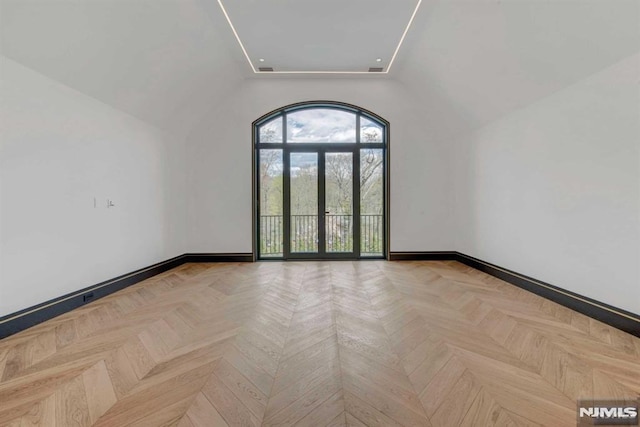 empty room with french doors and light parquet floors