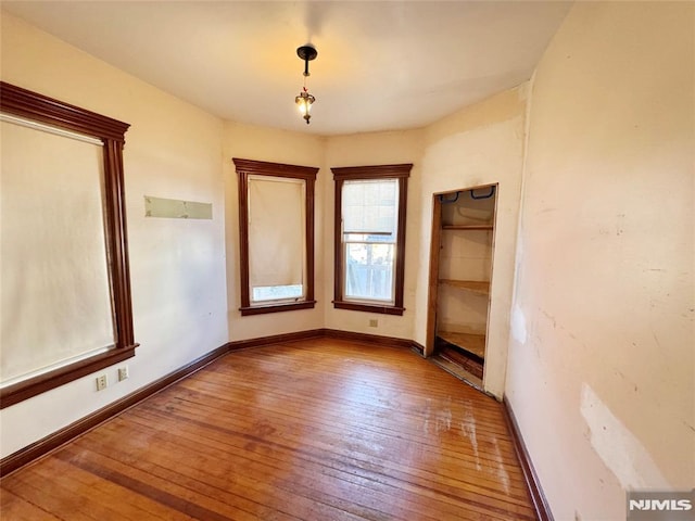 unfurnished bedroom with light wood-type flooring