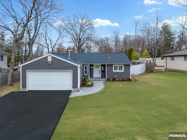 view of front of home with a front lawn and a garage