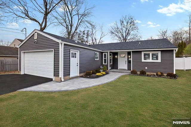 single story home with a garage and a front lawn