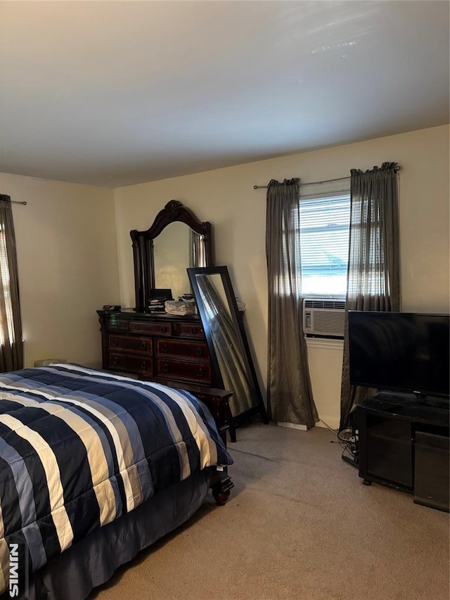 bedroom with light carpet and cooling unit