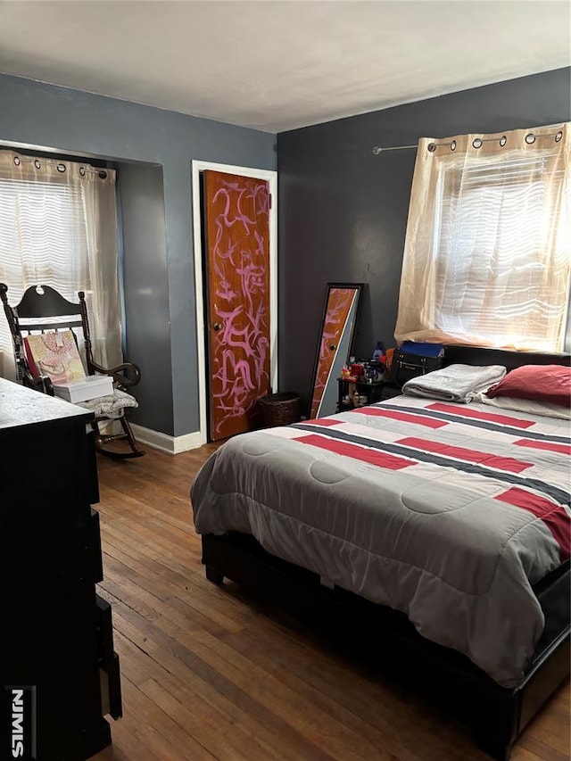 bedroom with hardwood / wood-style flooring