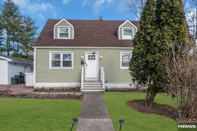 cape cod-style house with a front lawn