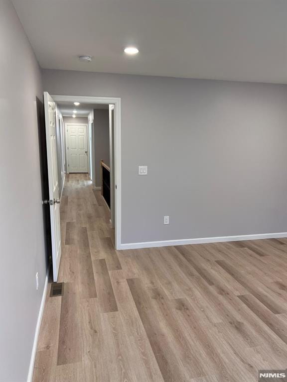 corridor featuring light hardwood / wood-style flooring