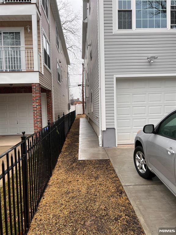 view of side of home featuring a garage