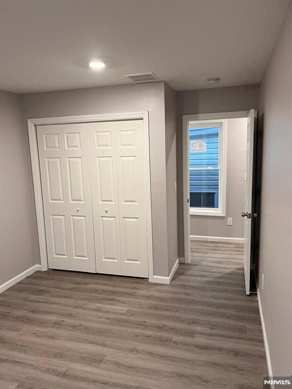 interior space with dark hardwood / wood-style flooring