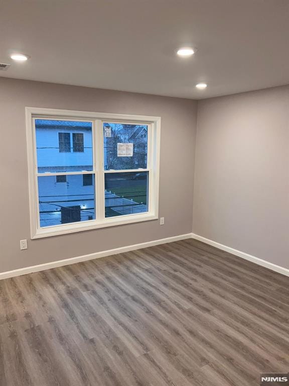 empty room featuring hardwood / wood-style floors