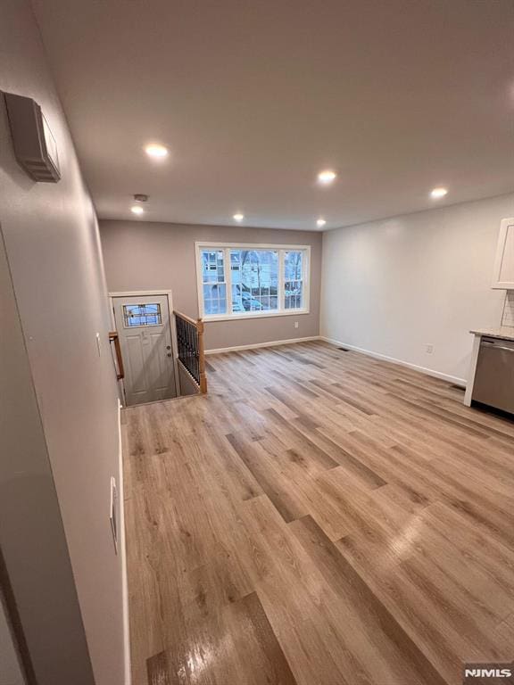 unfurnished living room with light hardwood / wood-style floors