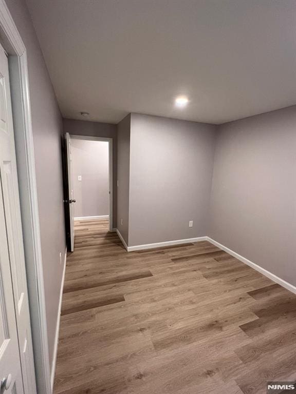 spare room with light hardwood / wood-style floors