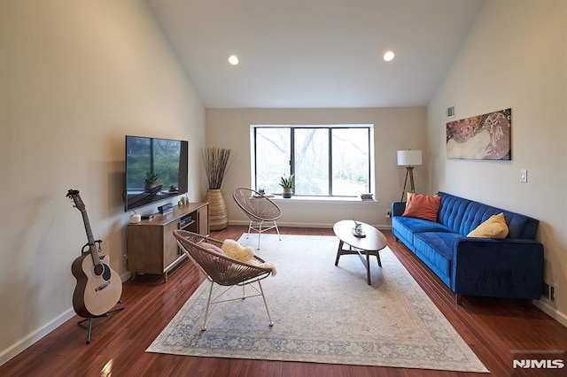 living room with high vaulted ceiling and dark wood-type flooring