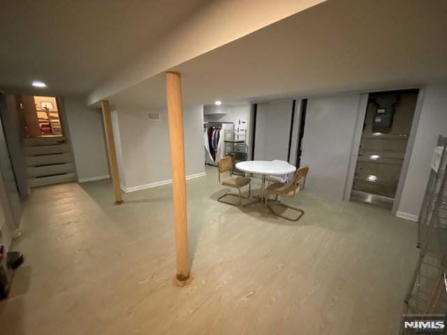 basement featuring light hardwood / wood-style flooring