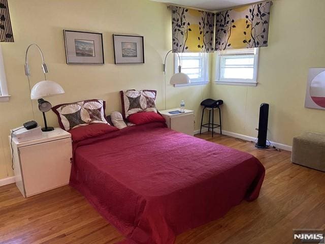 bedroom with wood-type flooring