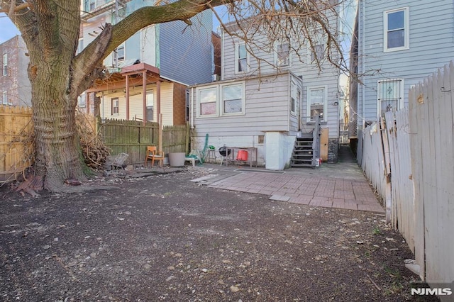 back of house featuring a patio area