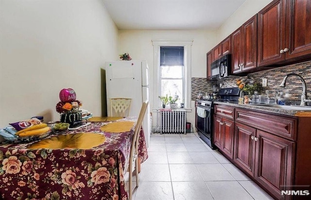 kitchen featuring black appliances, light tile patterned floors, radiator, sink, and backsplash