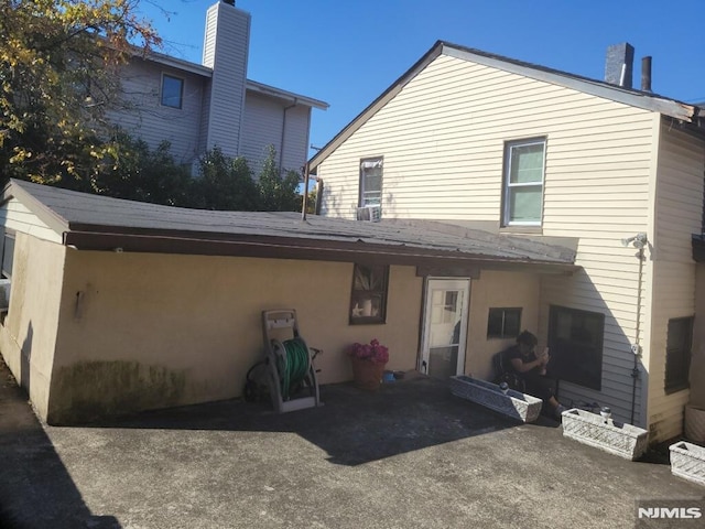 back of house with a patio area