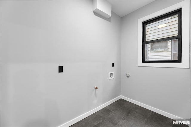 clothes washing area featuring hookup for a washing machine and gas dryer hookup