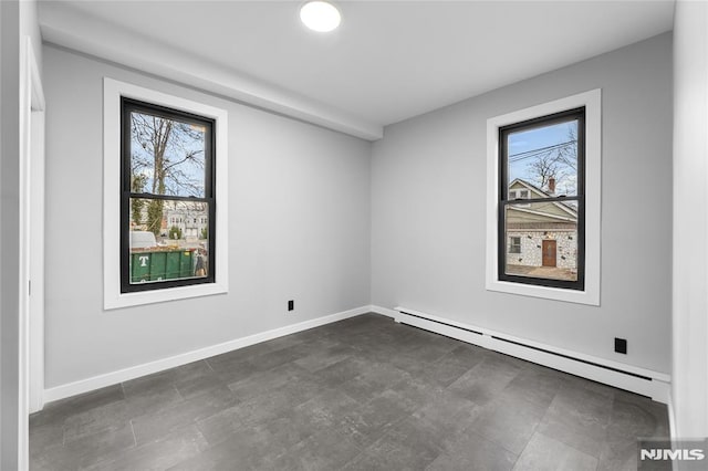 spare room featuring baseboard heating