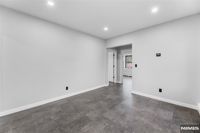 spare room with a baseboard radiator