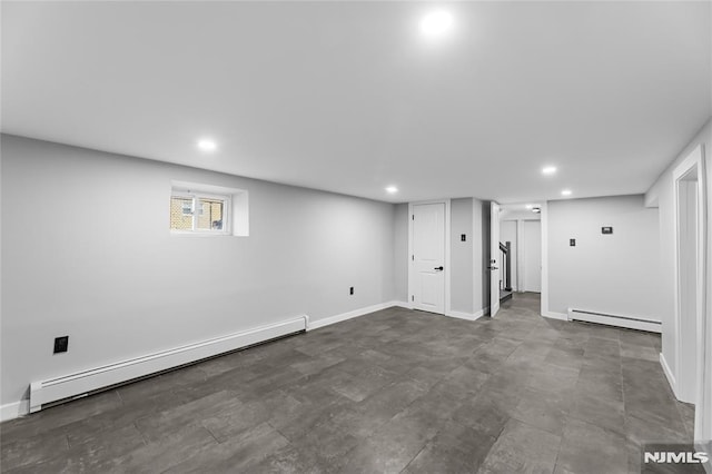 basement featuring a baseboard heating unit