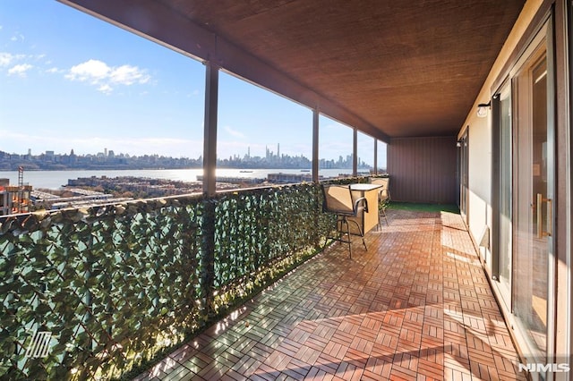 balcony featuring a water view