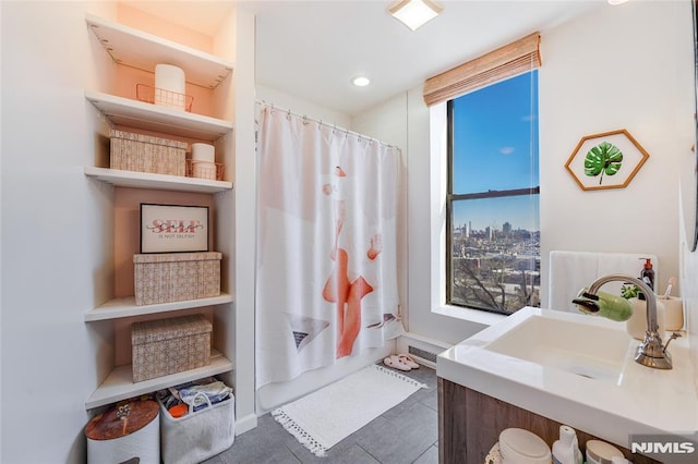 bathroom featuring sink and walk in shower