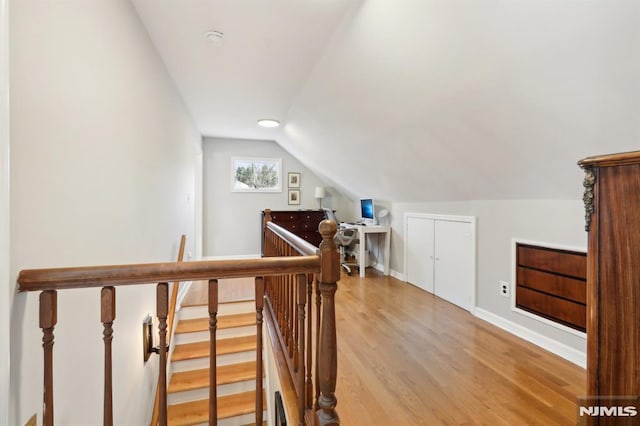 interior space with lofted ceiling and light hardwood / wood-style floors