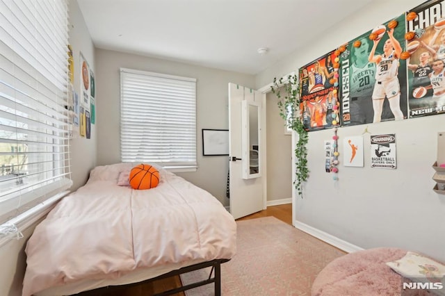 bedroom featuring multiple windows