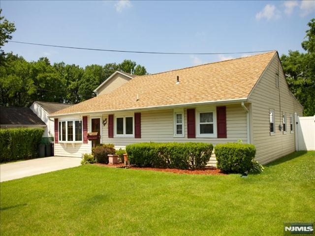 ranch-style house with a front lawn