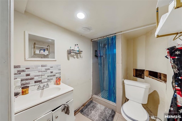 bathroom featuring tile patterned floors, a shower with curtain, vanity, and toilet