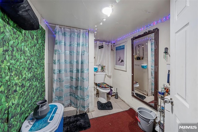 bathroom with tile patterned floors and toilet