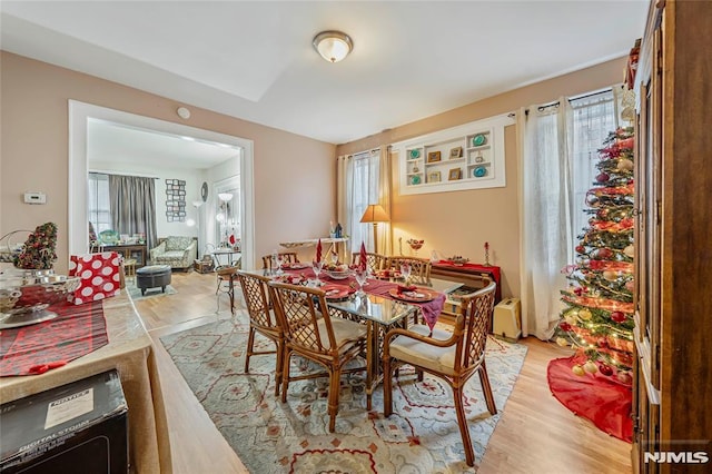 dining area featuring light wood-type flooring